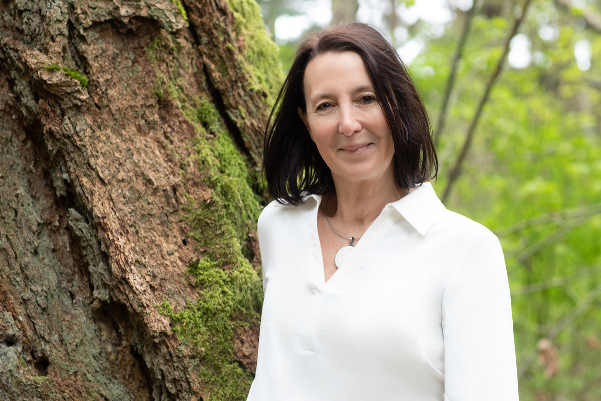 mature woman with beautiful skin in the rain forest in Victoria British Columbia