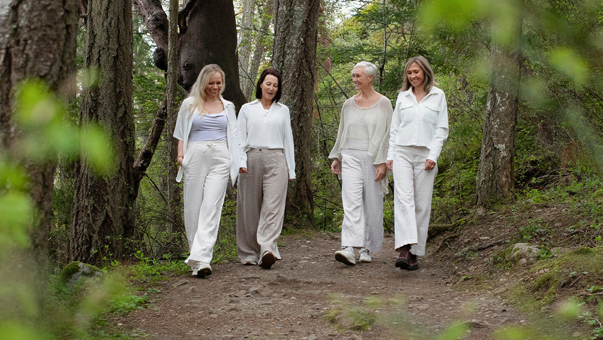Four women walking a forest path on Vancouver Island